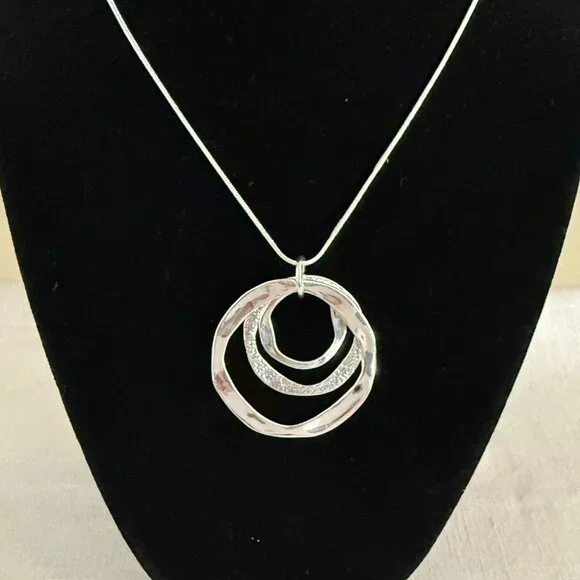 Silvertone Necklace 22-24 inches with Pendant Trio of Irregular Textured Rings - Picture 2 of 7